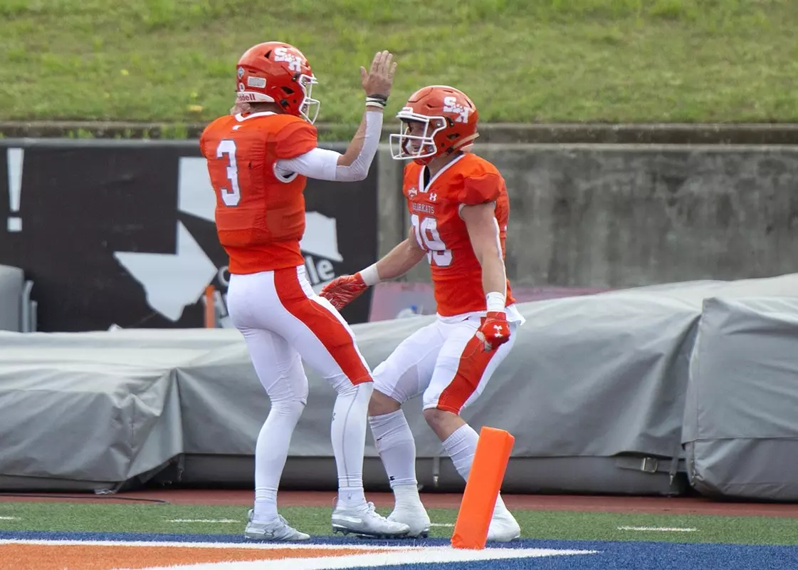 Eric Schmid and Cody Crest celebrate a TD against Monmouth