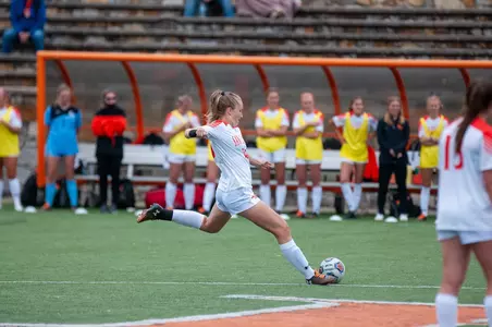 Katarina Baehren kicks a free kick against Lamar