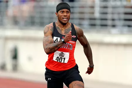 Bryan Henderson wins the 100 at SLC Championships