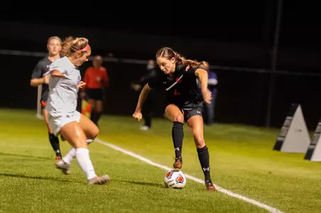 Courtney Pawlik dribbles against ACU