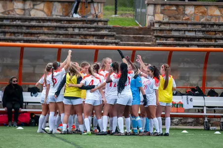 Soccer huddles before the game against Lamar