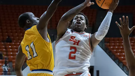Qua Grant drives to the basket against LeTourneau