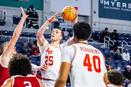 Cameron Huefner drives against South Dakota