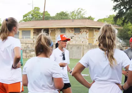 Coach Sonia Curvelo speaks to the team