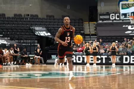Jaden Ray dribbles up court against Utah Valley