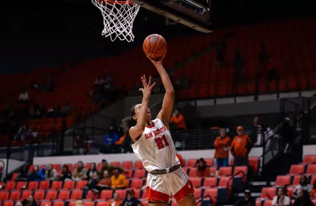 Madelyn Batista goes to the basket against Tx State
