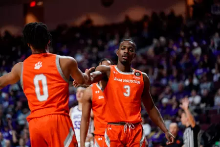 Demarkus Lampley fits bumps Javon Grant