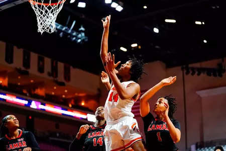 Raanee Smith puts up a shot against Lamar