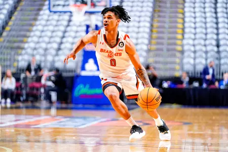 Javon Grant dribbles against California Baptist