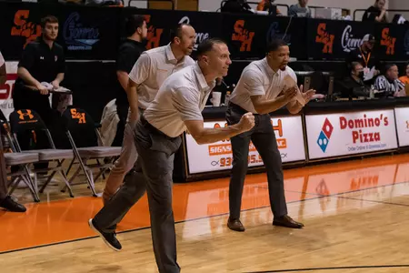 Coach Hooten celebrates a basket