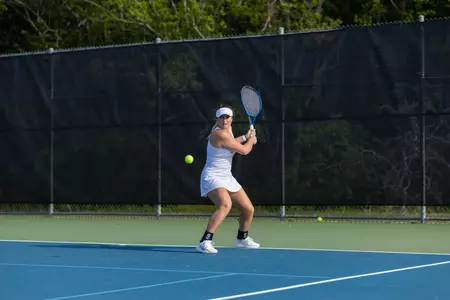 Petra Kaszas returns a shot against NM State