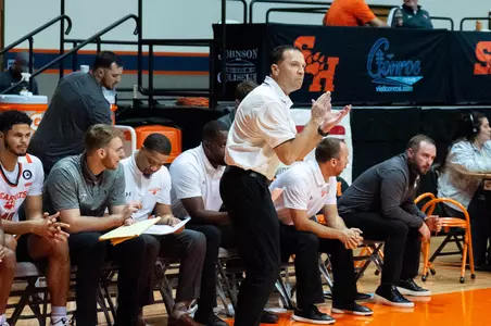 Jason Hooten claps at good play against Hardin-Simmons