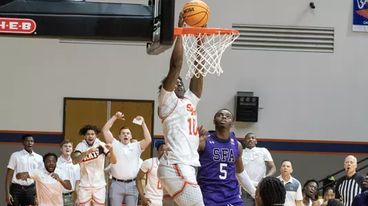 Damon Nicholas Jr. goes up for a shot against SFA