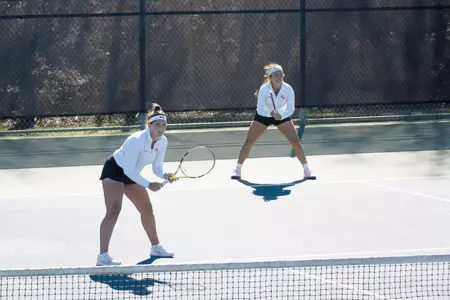 Megan Basson and Paula Cerda play doubles against Lamar