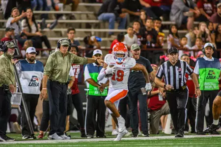 Malik Phillips runs with a reception against NM State
