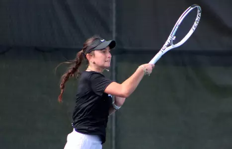 India Fenleys returns a shot
