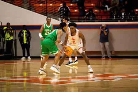 Marcus Boykin guards a Utah Valley player