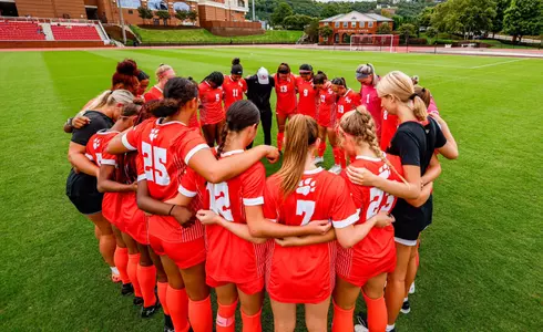 Soccer huddles with Coach Curvelo