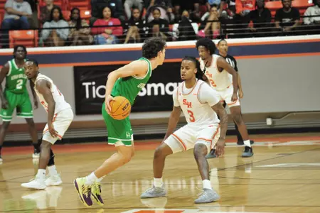 Lamar Wilkerson guards a Utah Valley ballhandler