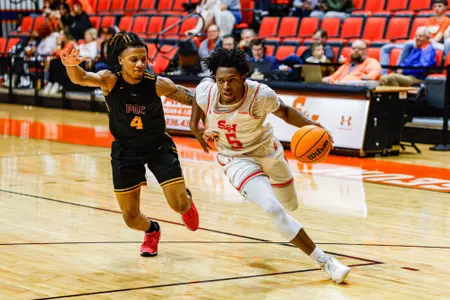 Marcus Boykin drives against Paul Quinn