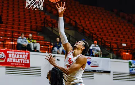 Owen McGlashan puts up a shot against Paul Quinn
