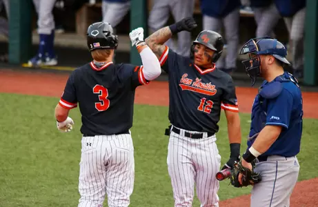 Walker Janek and Clayton Chadwick celebrate a home run