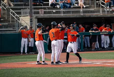 Lane Brewster celebrates with teammates after hitting a grand slam against RIU