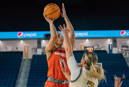Madelyn Batista shoots over a CBU defender