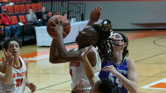 Mikayla Woods drives to the basket against GCU