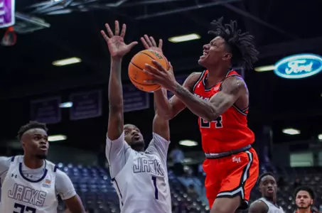 Donte Powers drives to the basket against SFA