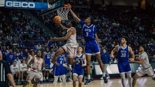 Qua Grant drives to the basket against GCU