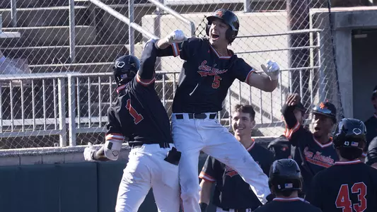 Myles Jefferson and Justin Wishkoski celebrate Jefferson's home run