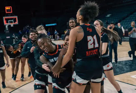 Mikayla Woods celebrates hitting the game winner against ACU