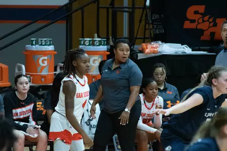 Coach Ravon Justice roams the sideline against Utah Valley