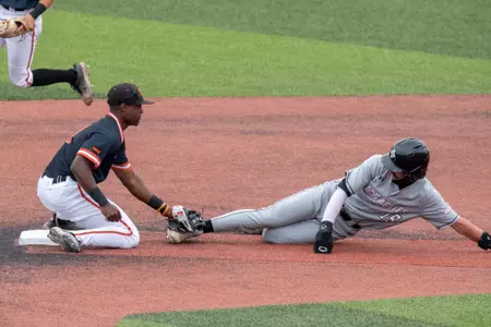 Myles Jefferson tags out a NM State runner at second base