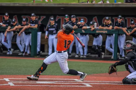 Clayton Chadwick swings at a pitch against NM State