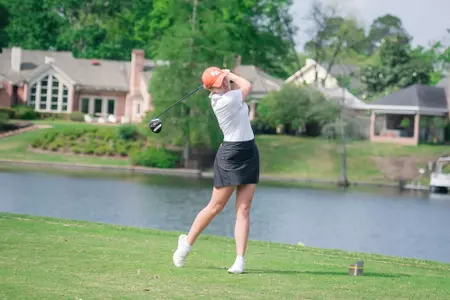 Jennifer Herbst tees off at the ULM Invitational