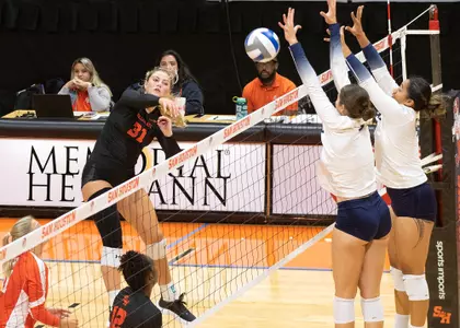 Payton Woods returns a shot against Oral Roberts