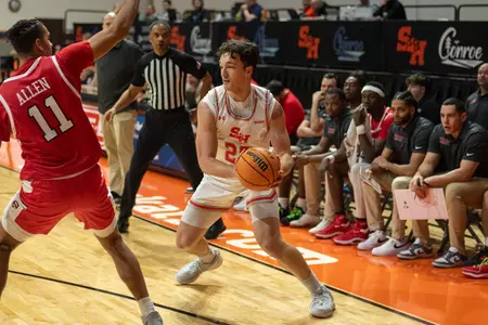 Cameron Huefner handles the ball against WKU