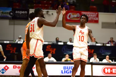 Damon Nicholas Jr., right, and Souleymane Doumbia celebrate against UTEP