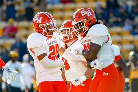 Jay Ducker celebrates with teammates at Kennesaw State