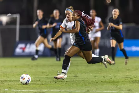 Cadence Sanders chases a Middle Tennessee player at the CUSA Championships