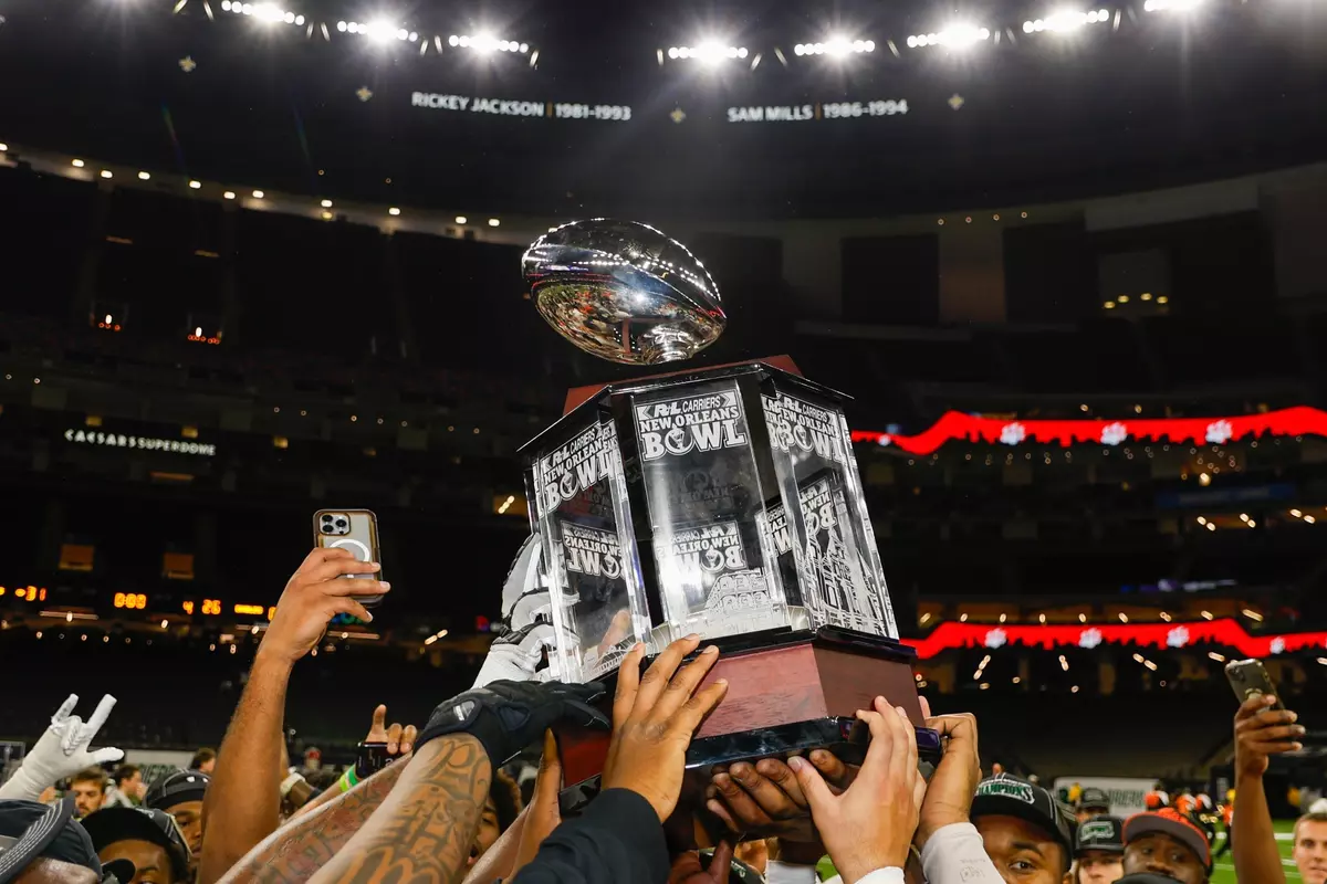The Bearkats hoist the R+L New Orleans Bowl championship trophy at the Superdome.