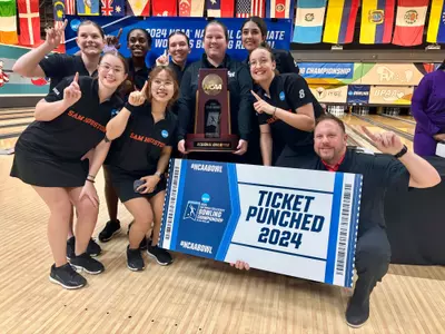 The bowling team celebrates winning the Arlington Regional