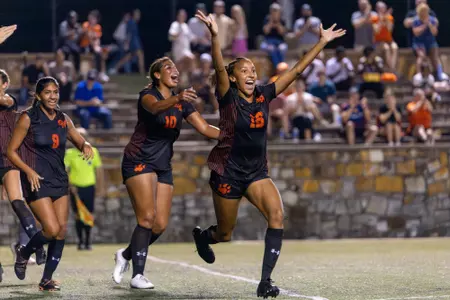 Indigo Sims cheers after scoring the game-winning goal against Southern