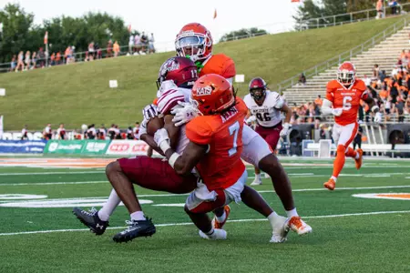 Emon Allen helps coral a NM State receiver in Sam Houston's 31-11 victory