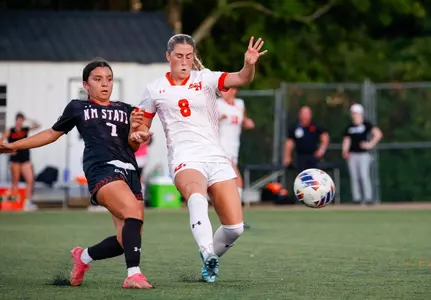 Kinsey Hill fights for the ball against NM State