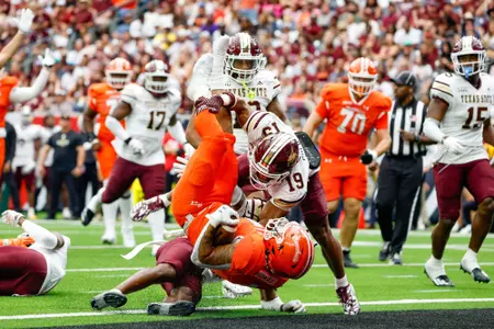 Jay Ducker flips into the end zone after scoring against Texas State at NRG Stadium