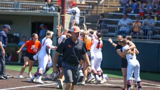 Head coach Garrett Valis walks away as the team celebrates a home run against LA Tech