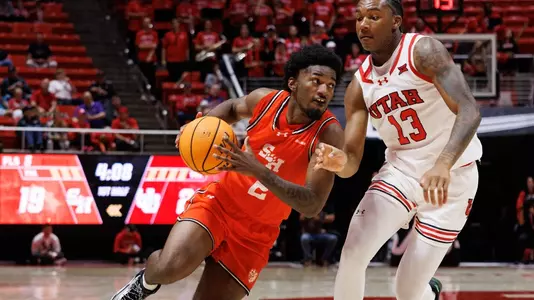 Jacobe Coleman drives the lane against Utah